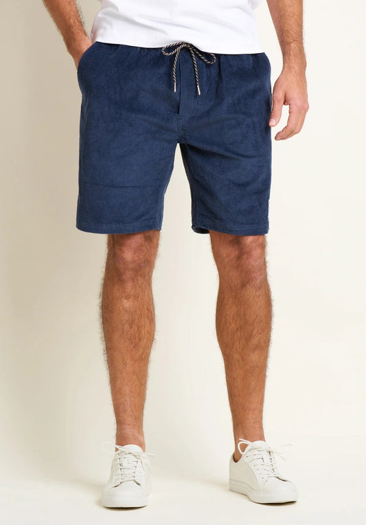 Brakeburn cord shorts mens navy with drawstring waist and front pockets styled with white sneakers