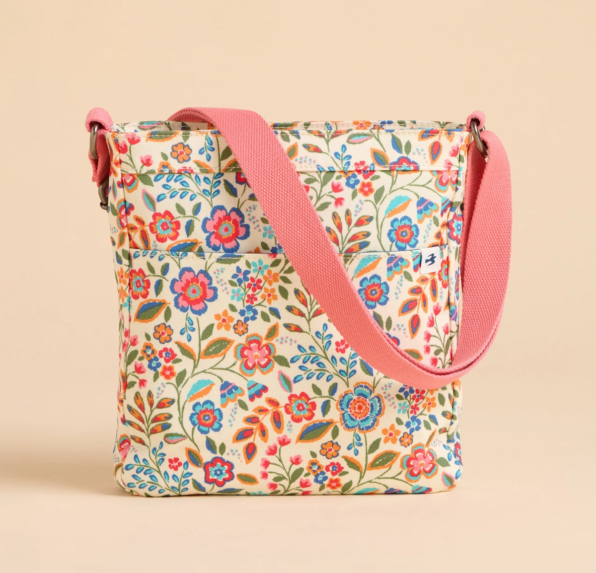 Brakeburn Secret Garden floral cross body bag with pink strap and colorful flower pattern