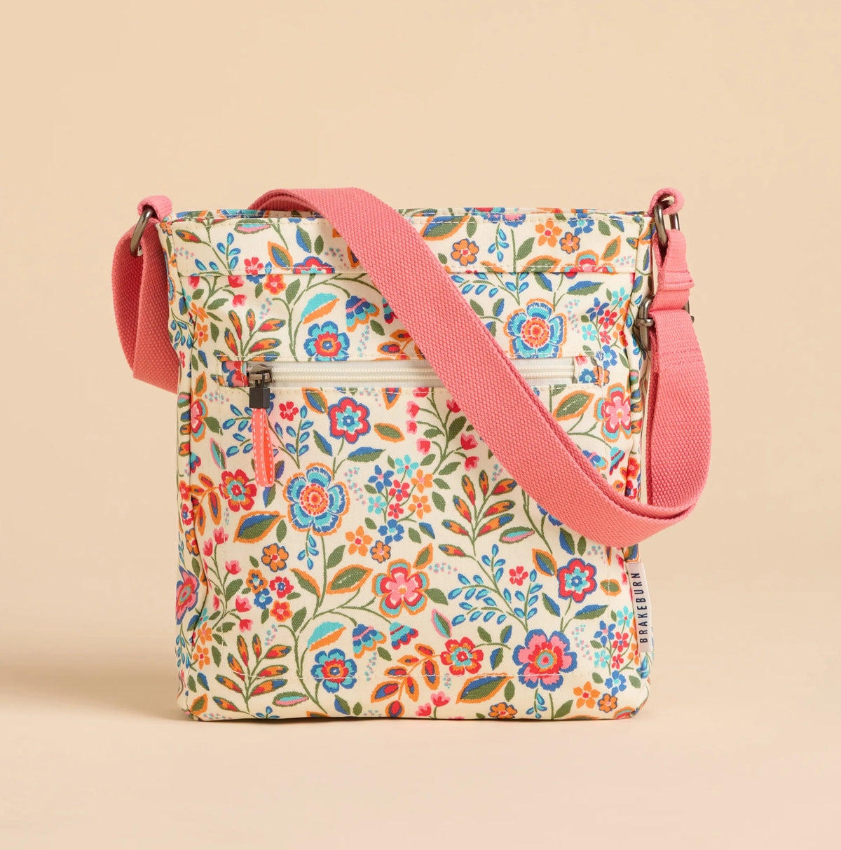 Brakeburn Secret Garden floral cross body bag with colorful flower print and pink adjustable strap