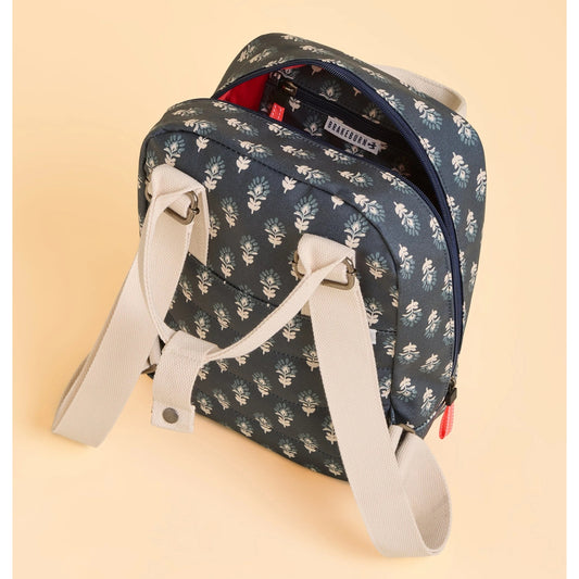 Brakeburn navy Henna floral-patterned backpack with beige straps on a beige background