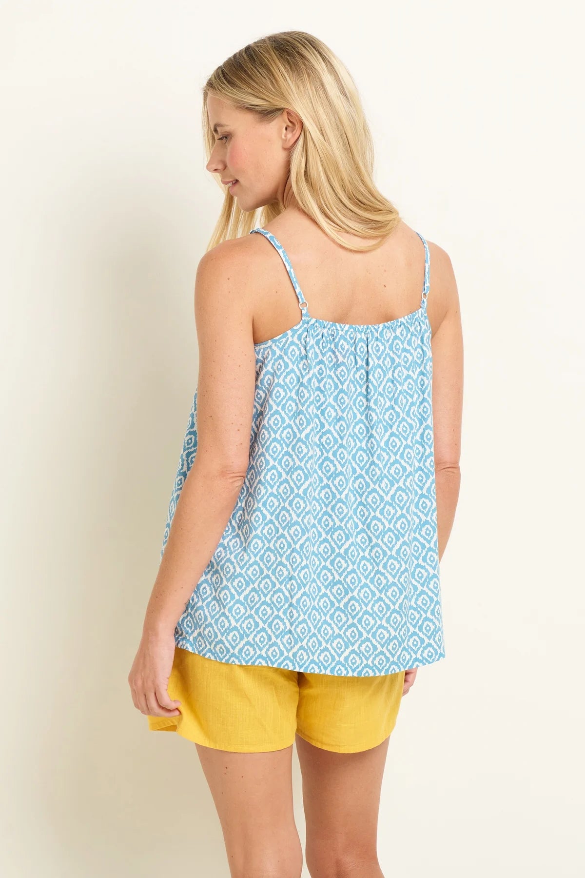 Brakeburn womens blue camisole with white geometric pattern and adjustable straps shown from back