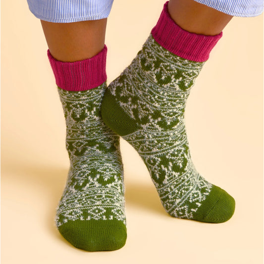 Brakeburn womens green Nordic patterned socks with pink cuffs on a beige background