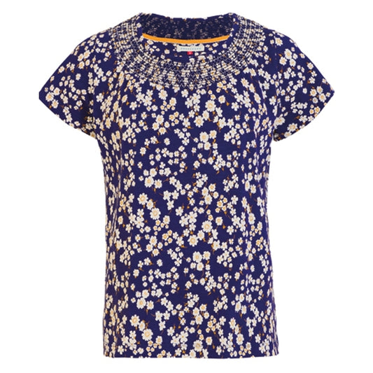 Front view of a Brakeburn womens Floating Daisy t-shirt in navy blue with a small white floral pattern on a white background