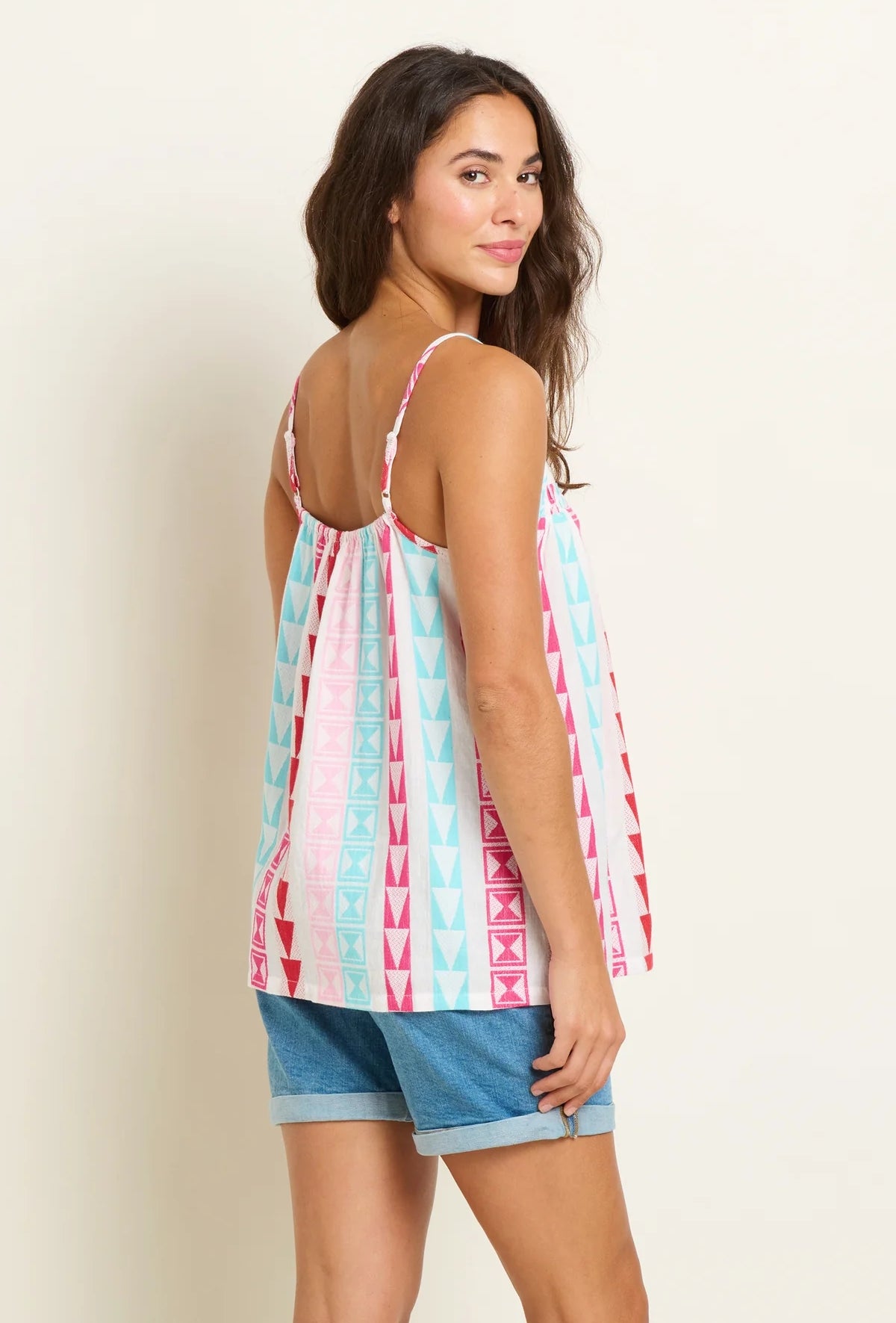 Brakeburn womens Rosie vest with colorful geometric pattern worn with denim shorts