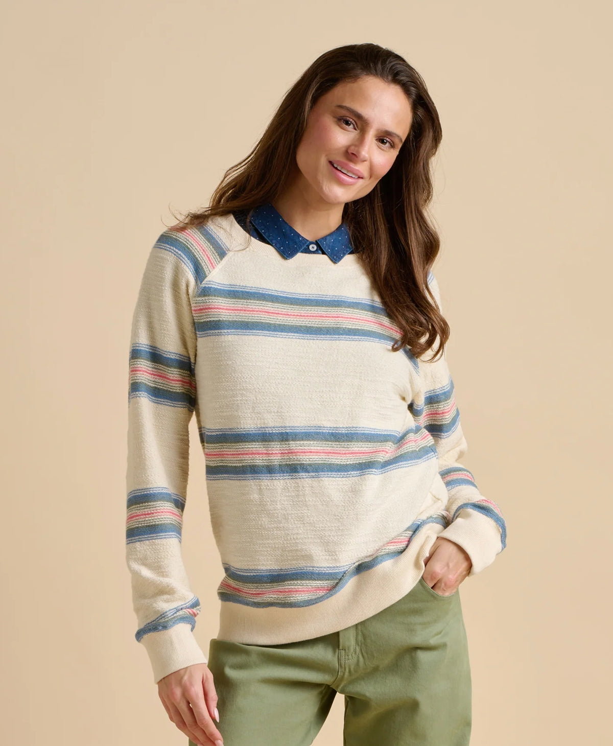 Brakeburn womens stripe jumper sweat in cream with blue and pink stripes worn by smiling woman