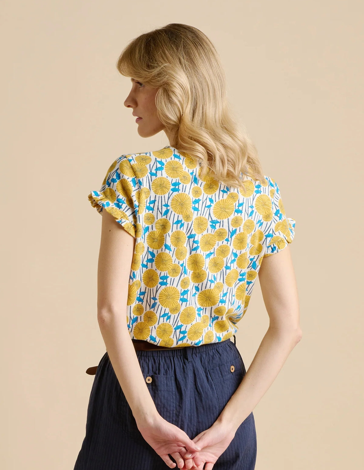 Brakeburn womens yellow t-shirt with blue and yellow floral pattern worn by model facing backwards