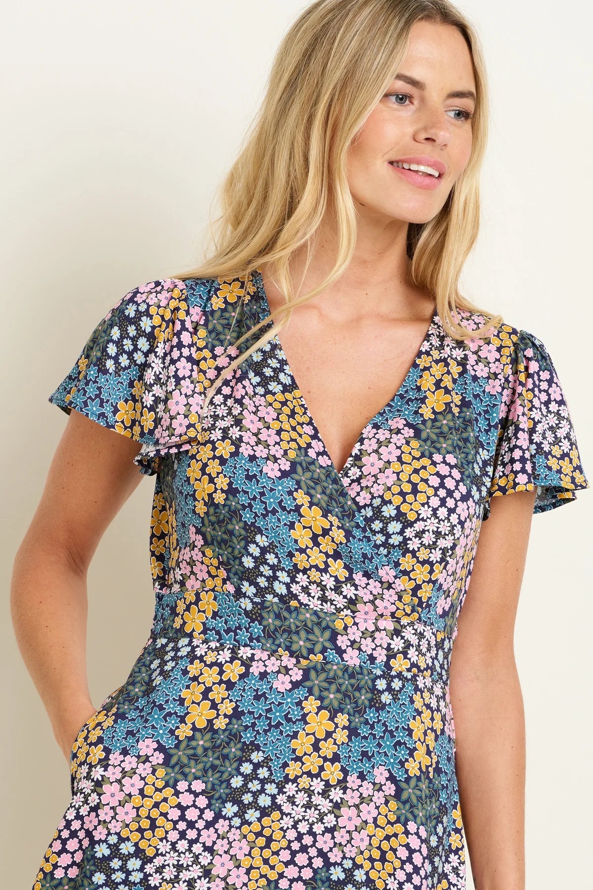 Women's Brakeburn wrap neck short sleeve knee length multicoloured Wildflower Meadow floral print dress.