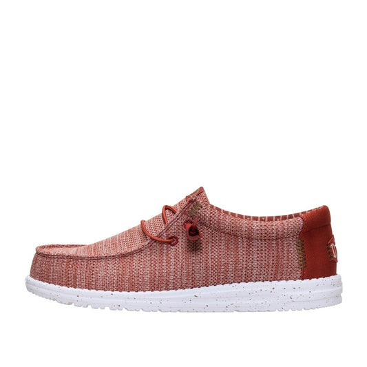 Side view of a men's Dude Wally Stretch Sox lightweight mesh shoe in Burnt Red / Multi, with elastic laces and a white speckled sole.