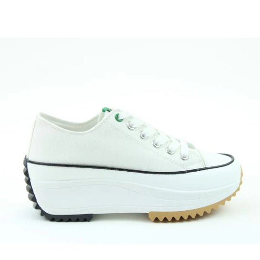 Side view of a Heavenly Feet womens Strata white lace up canvas shoe with white platform sole.