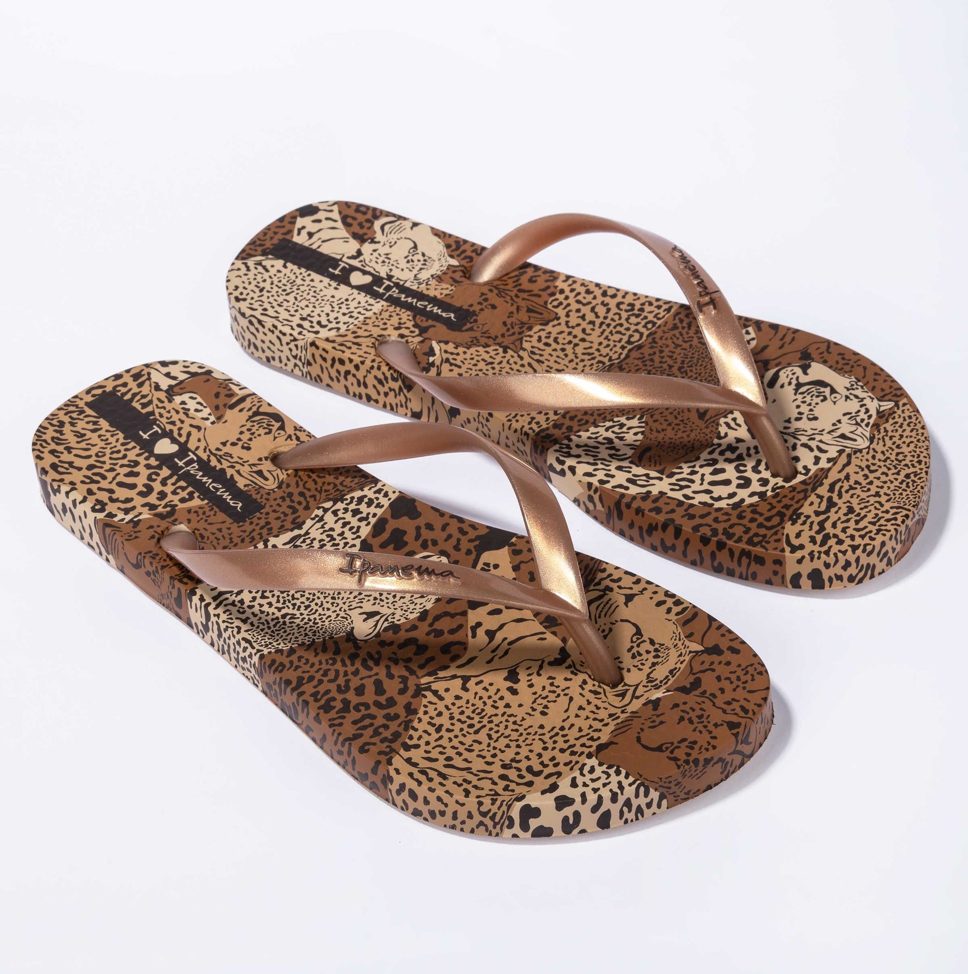 Front view of Ipanema womens animal print flip flops with brown metallic straps and leopard pattern sole