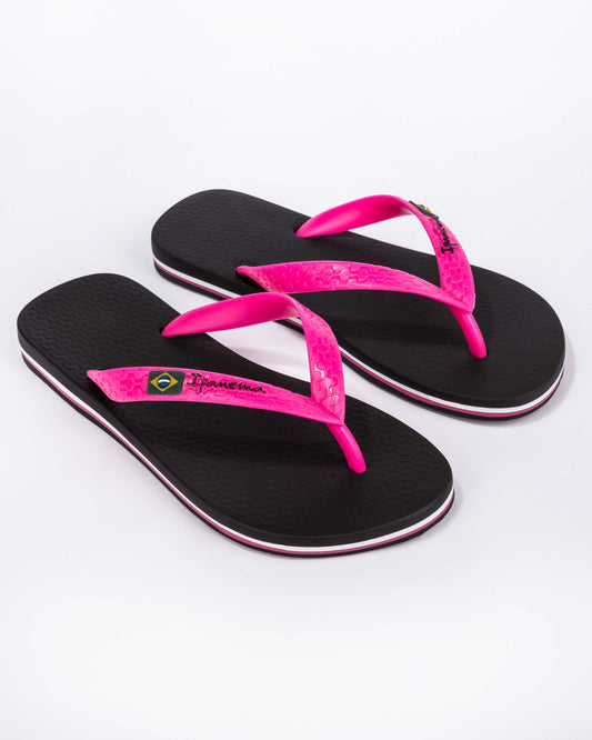Front view of Ipanema womens black and pink strap flip flops brazil with textured footbed and Brazilian flag detail on straps