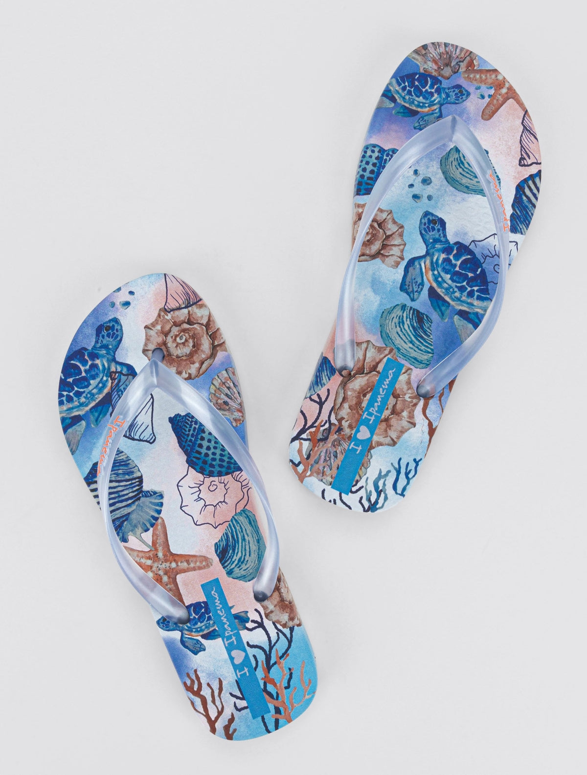 Ipanema womens tropical sea print flip flops featuring blue turtles and seashell design