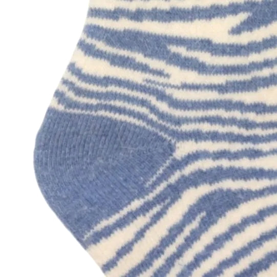 Close-up view of a pair of womens Jess and Lou cosy wool-blend socks in blue zebra print.