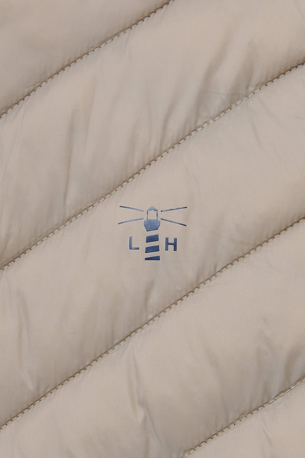 Small front logo on the Lighthouse mocha Laurel coat