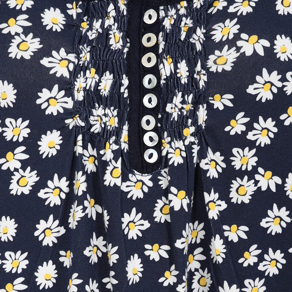 Lazy Jacks floral tunic featuring a navy background with white and yellow daisies and button chest