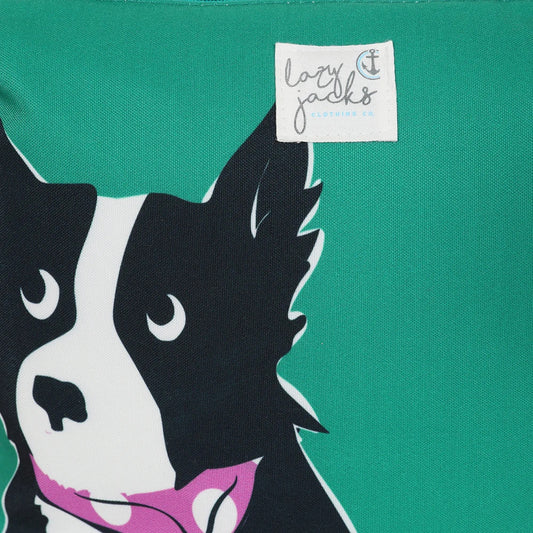 Close up of Lazy Jacks green sheep dog bag with black and white dog illustration on green fabric
