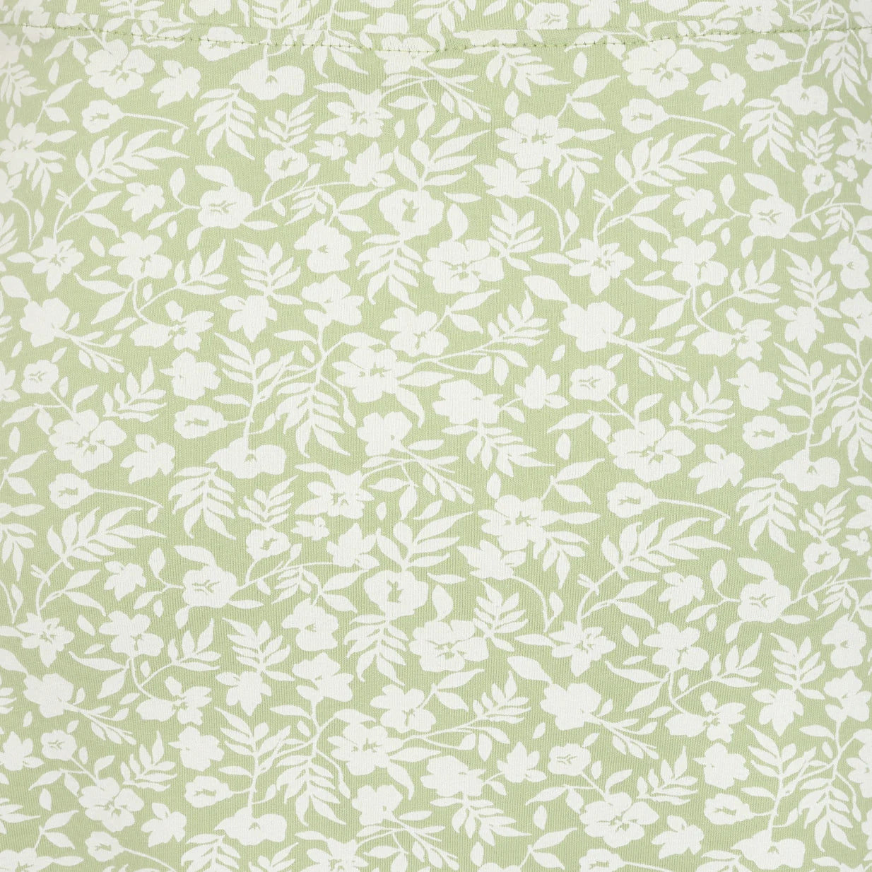Close-up view of the grass green and white floral print of a women's Lazy Jacks LJ41 jersey skirt.