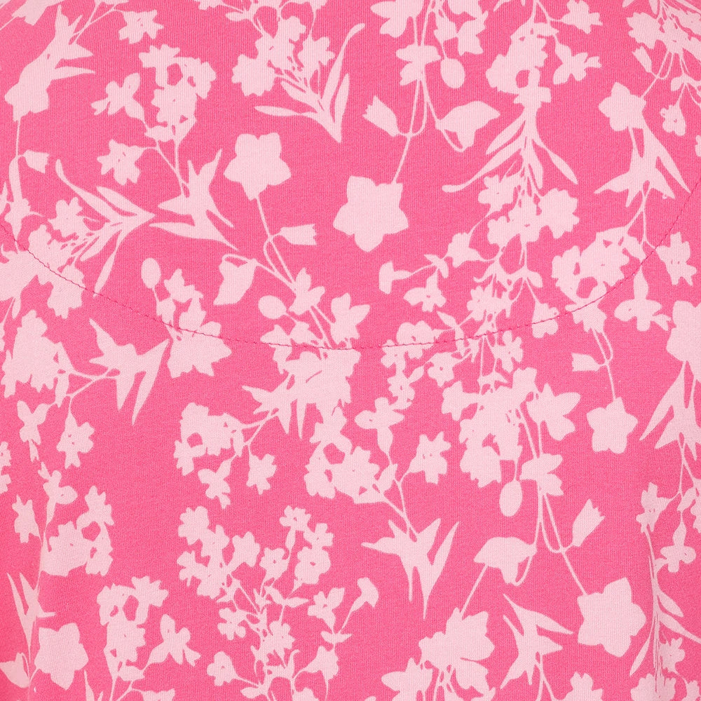 Close-up of Lazy Jacks womens floral dress pink with white flower pattern on bright pink fabric