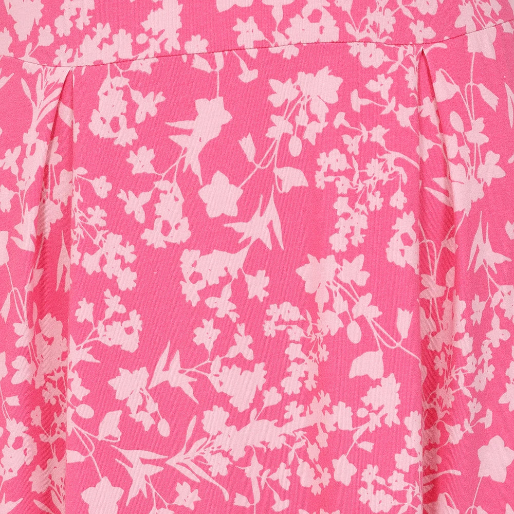 Close-up of fabric pattern on Lazy Jacks womens floral dress pink featuring light floral prints on bright pink background