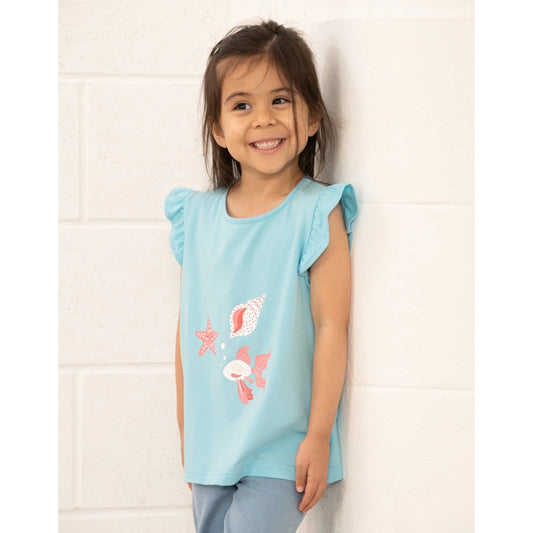 Young girl wearing a light blue Lighthouse sleeveless top with shell designs against a white background