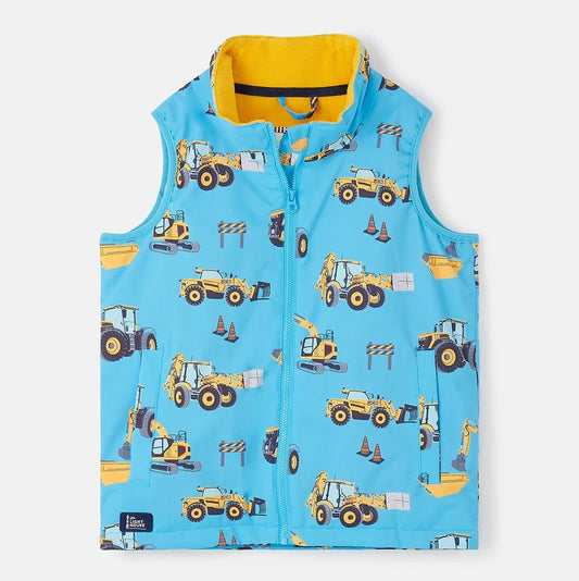 Front view of a Lighthouse kids blue gilet JCB print with yellow inner lining and construction vehicle pattern