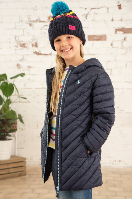 Main view of a Lighthouse kids navy Georgia padded coat worn by smiling girl with colourful hat indoors
