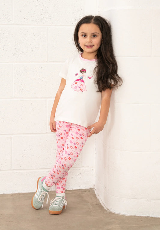 Lighthouse Kids pink floral leggings worn by girl with white graphic t shirt and sneakers