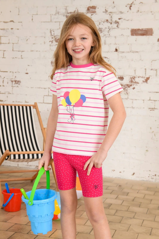Lighthouse Kids Shorts pink dot worn by girl with striped shirt holding blue bucket indoors