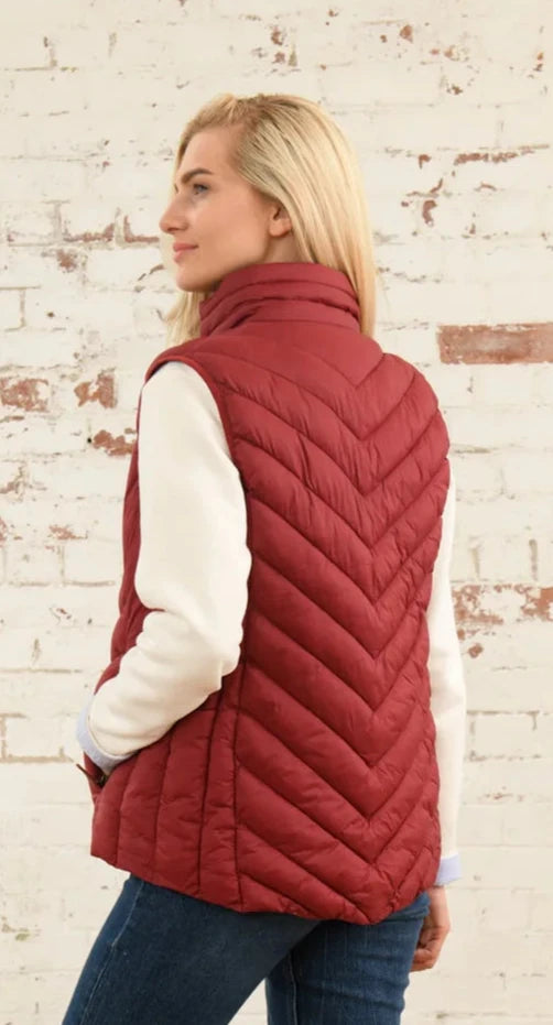 Lighthouse womens Laurel padded gilet red shown from the back on a blonde model wearing a white long sleeve shirt