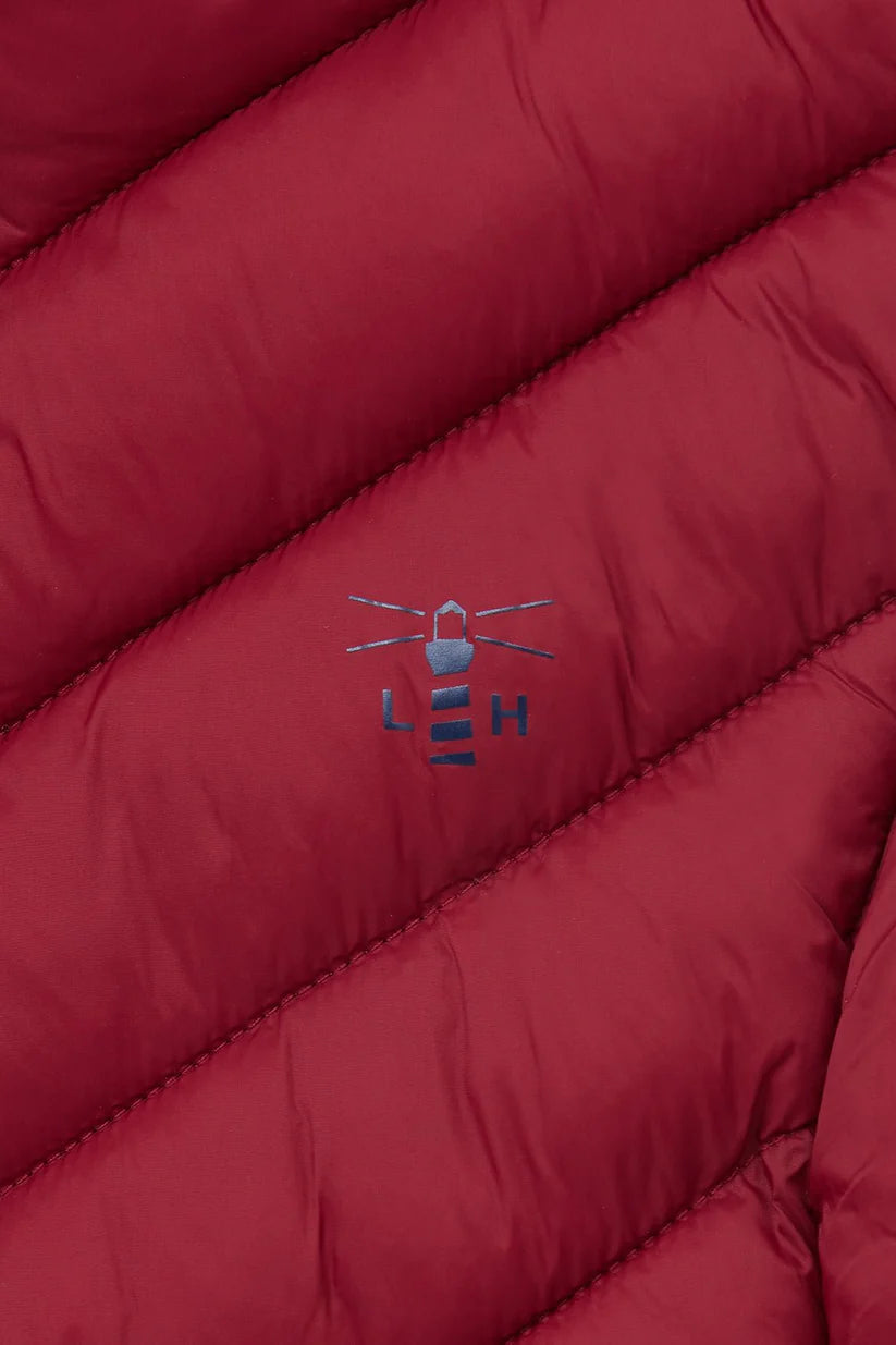 Lighthouse womens Laurel padded gilet red close-up showing logo on quilted fabric