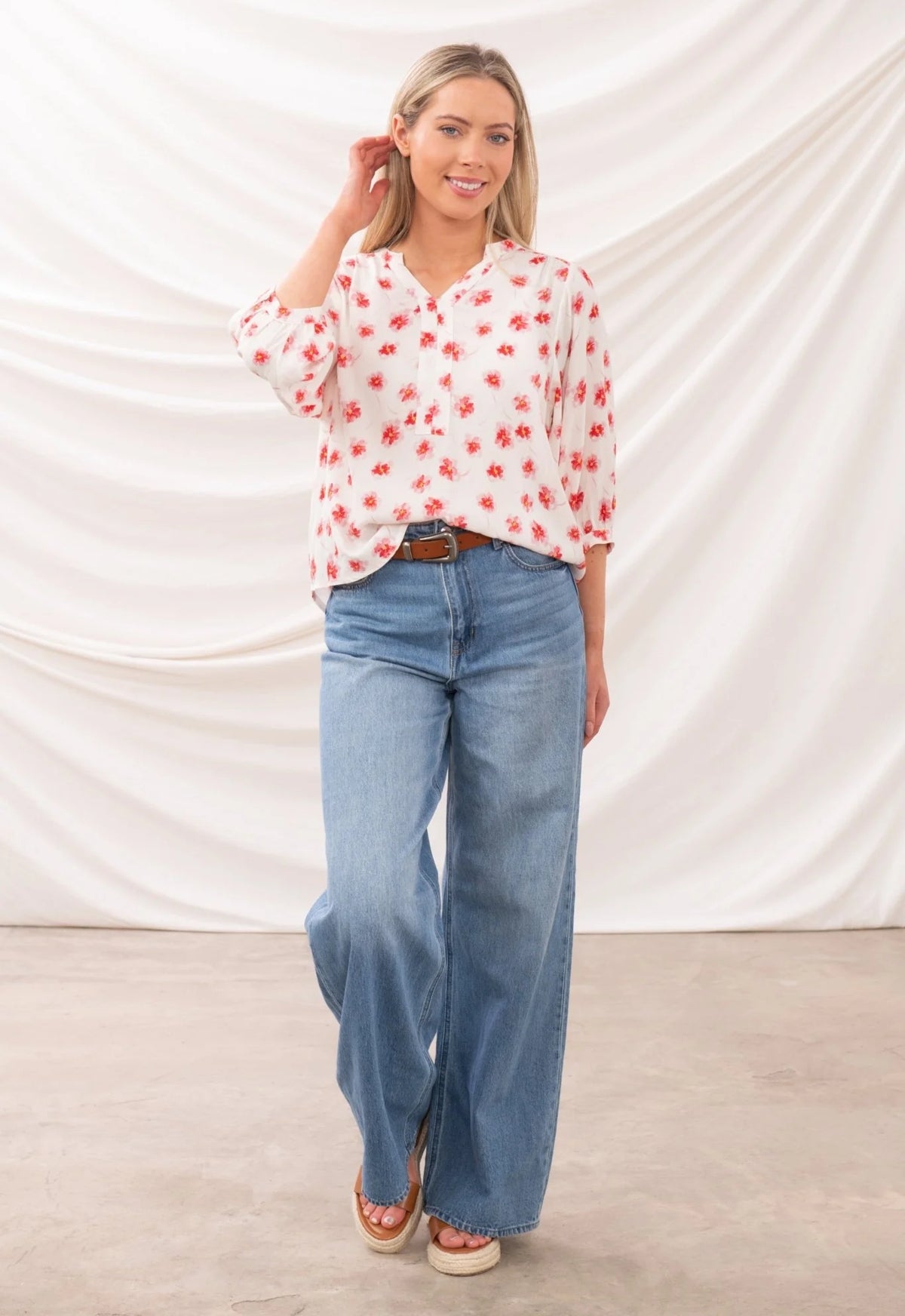 Lighthouse womens Lola blouse white with red floral print worn with blue wide-leg jeans and sandals