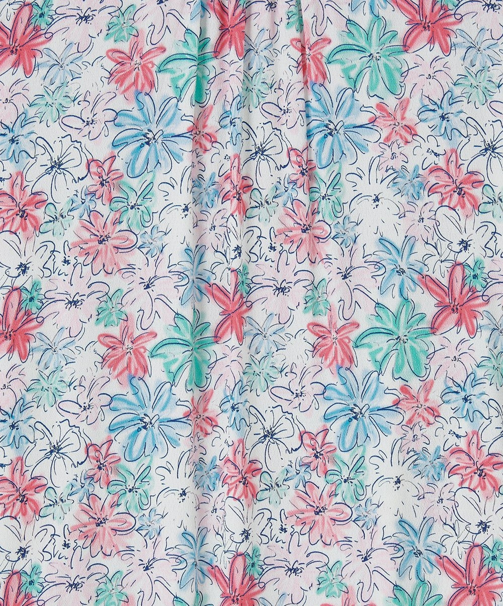 Close-up of colorful floral pattern on Lighthouse womens Lola floral blouse with red blue and green flowers
