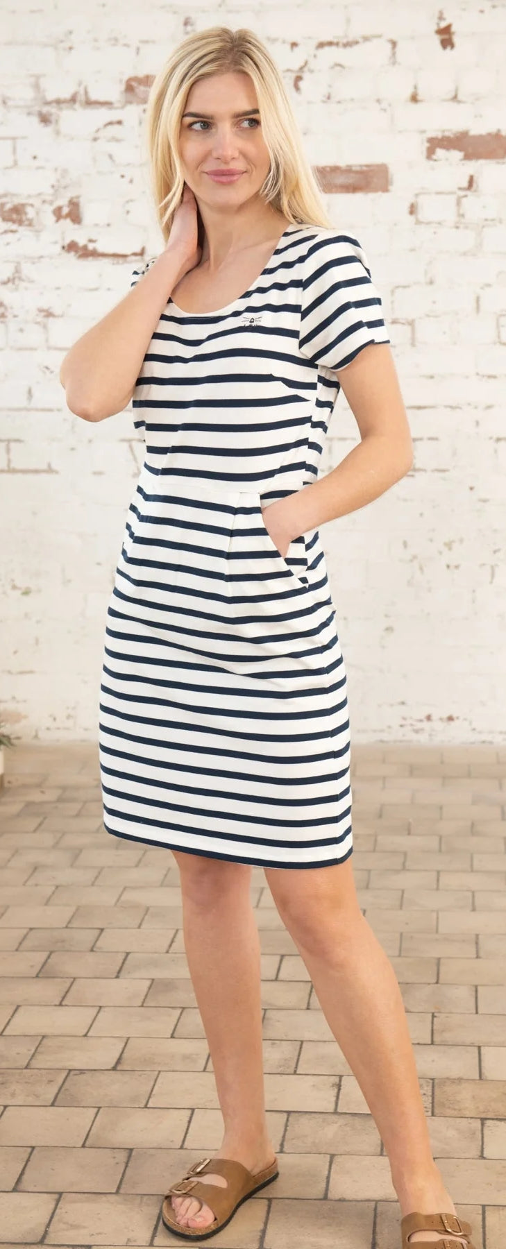 Lighthouse womens short sleeve stripe dress in navy and white worn by model with pockets