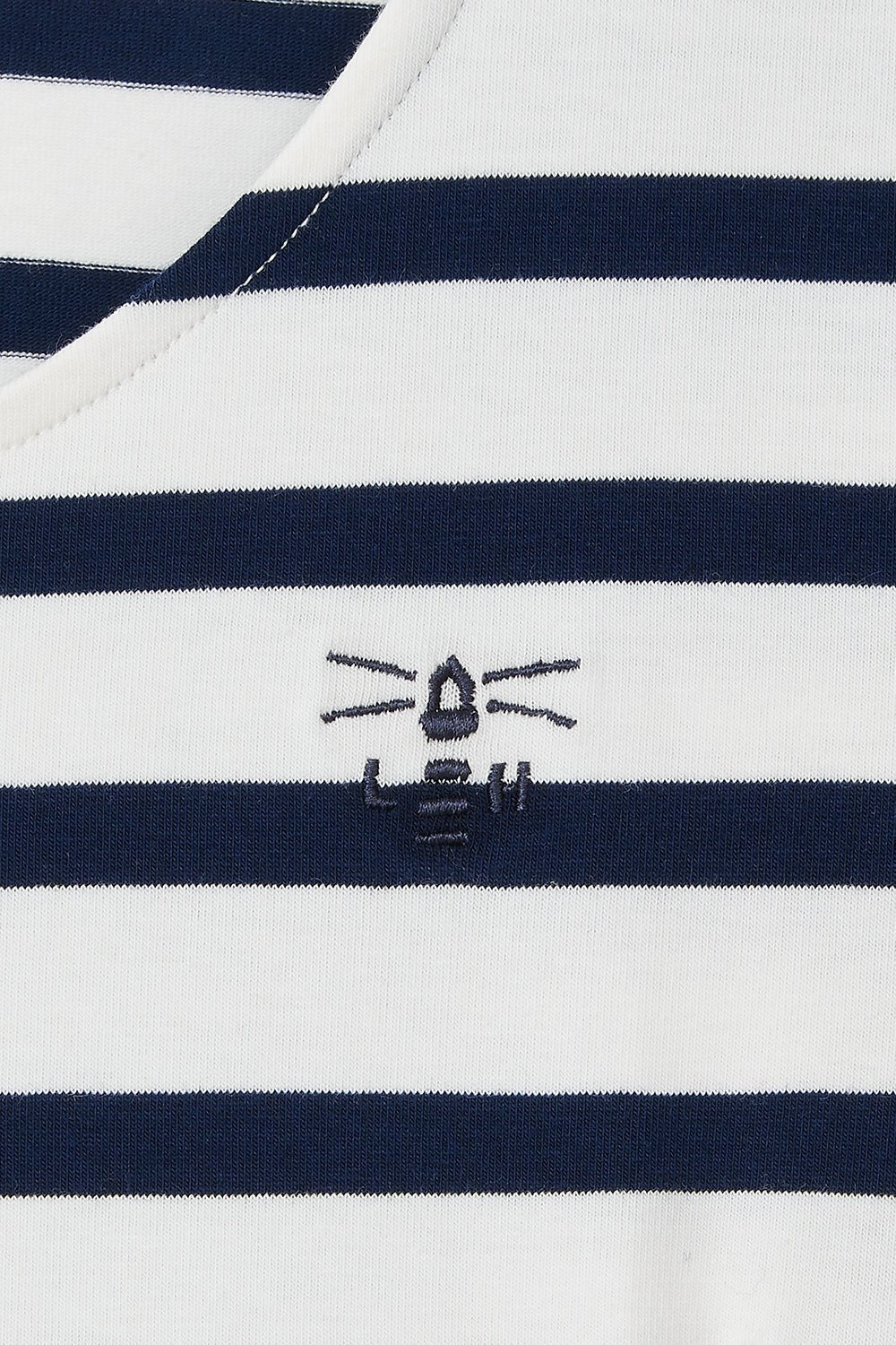 Close-up of Lighthouse womens short sleeve stripe dress with navy and white stripes and embroidered logo