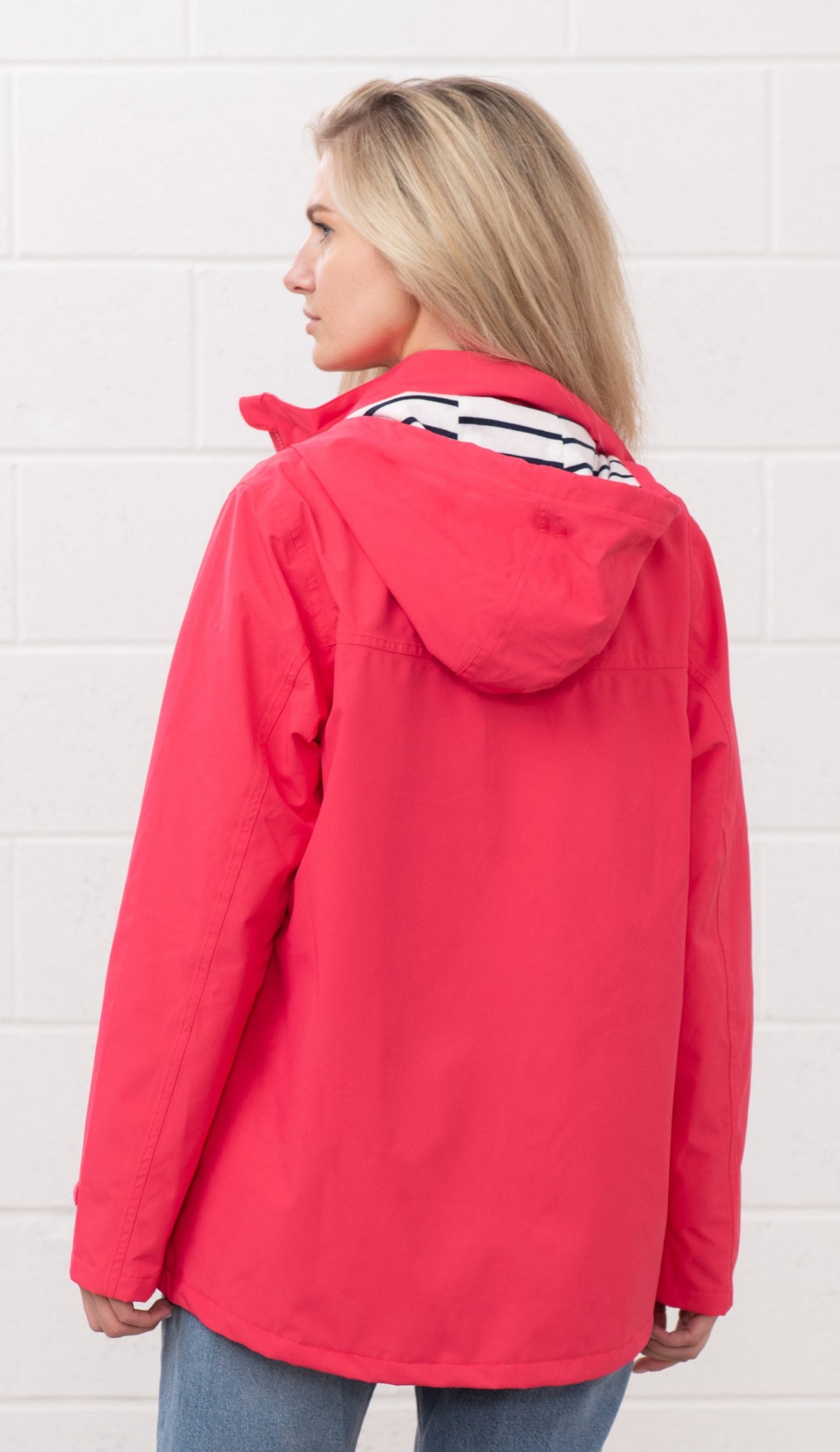Lighthouse womens waterproof jacket raspberry in bright pink with hood and striped inner lining