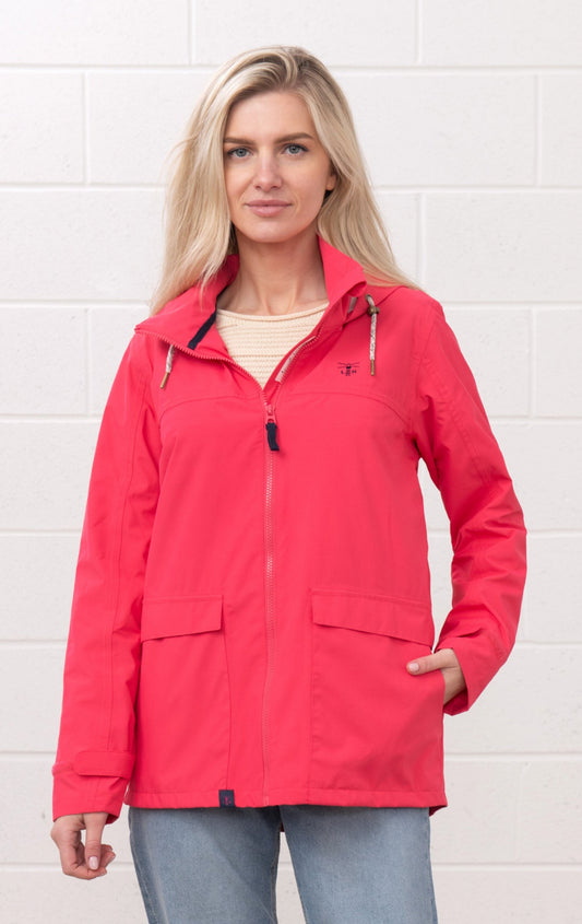 Lighthouse womens waterproof jacket raspberry worn by woman with front zipper and pockets