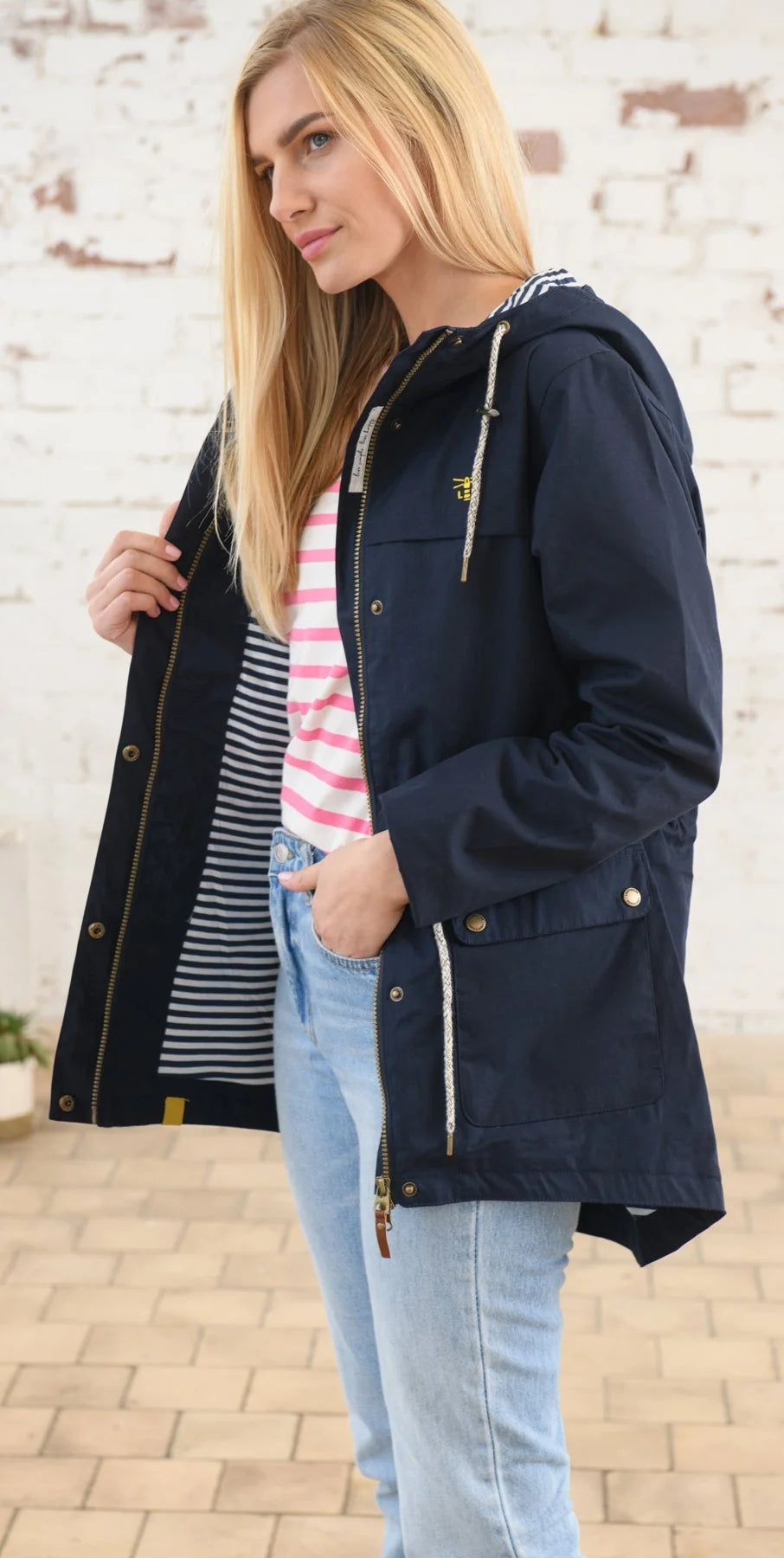 Stripe lined navy women's waterproof rain jacket from Lighthouse.