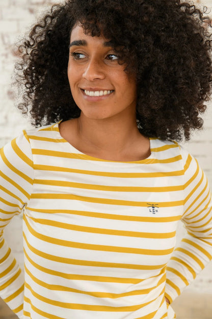 Women's Lighthouse Causeway breton top in white with yellow stripes and small logo embroidered on the chest.