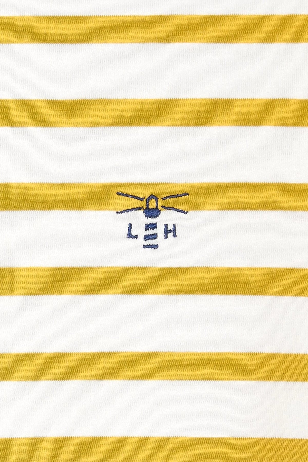 Women's white and yellow stripe Lighthouse Causeway breton top with small logo on the chest.