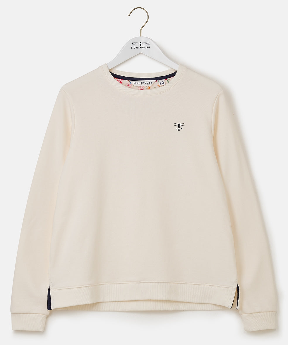 Lighthouse Seaside women's plain crew neck sweatshirt in Coconut with floral lining.