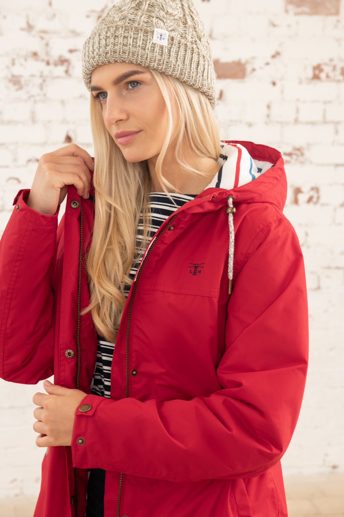 Lighthouse women's Eva Long padded waterproof raincoat in Red.