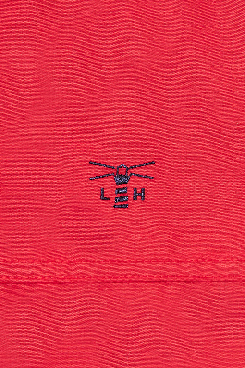 Women's waterproof Eva padded coat in Red from Lighthouse with embroidered chest logo.
