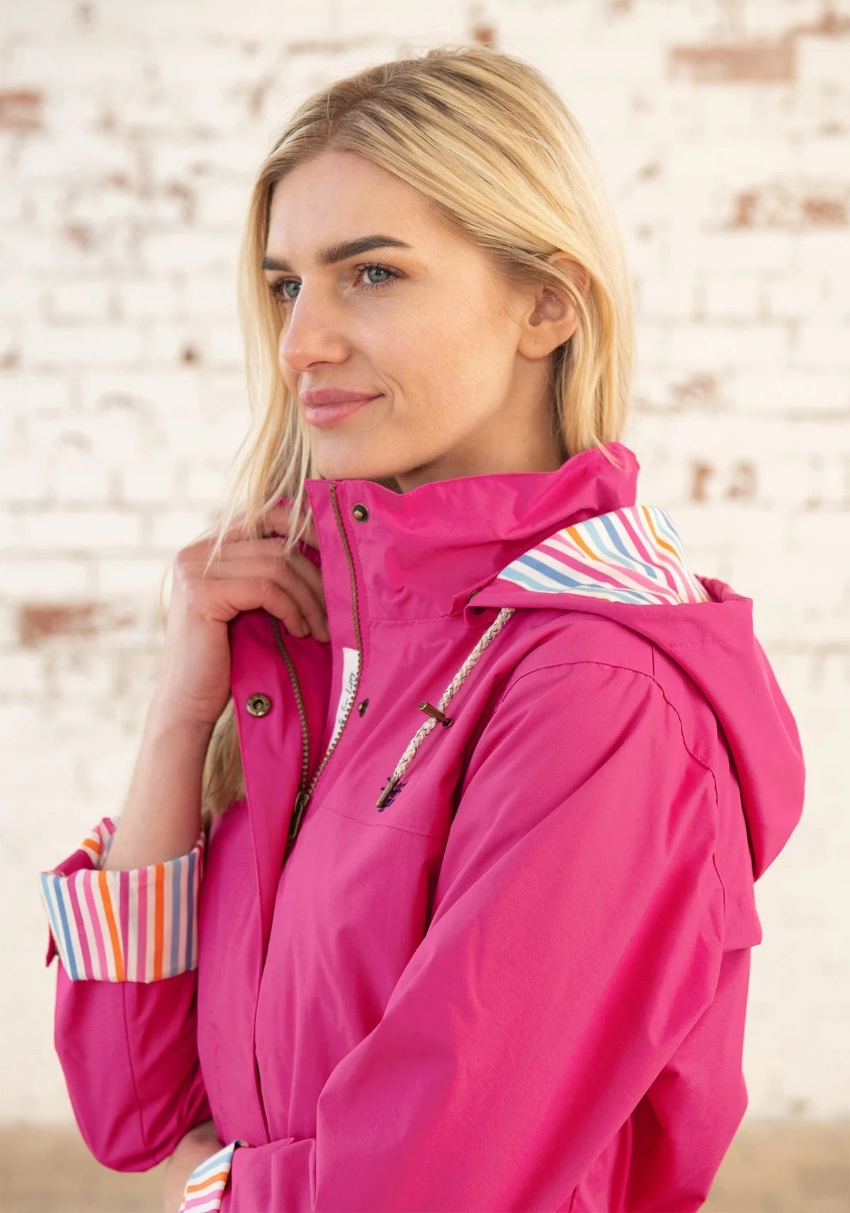 Women's Lighthouse hooded Rebecca waterproof raincoat in Azalea Pink.