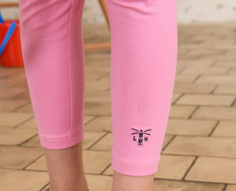 close up of lighhouse logo at the bottom of leg