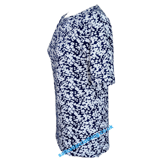 Side view of a womens short sleeve Mudd & Water Kendal top in navy with a white flower pattern on a white background