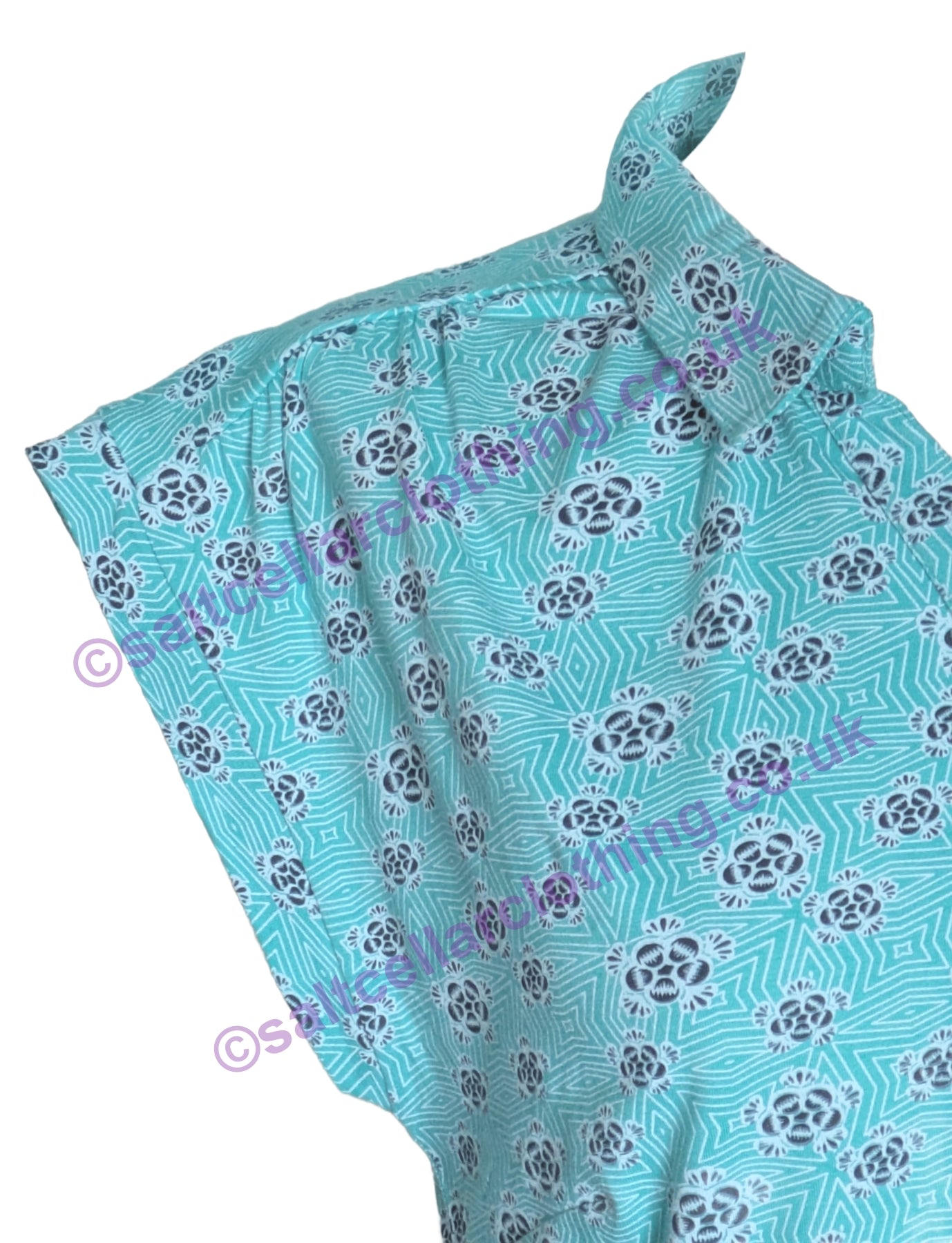 Close-up of a Mudd & Water short sleeve Alice Top in Ceramic Turquoise with a geo floral pattern, collared neckline and shoulder pleats on a white background