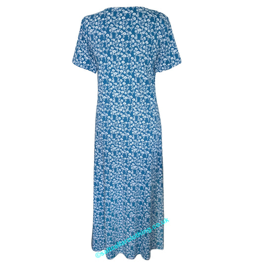 Back view of a Mudd & Water womens short sleeve Iris Dress in Teal blue with a white floral print, on a white background