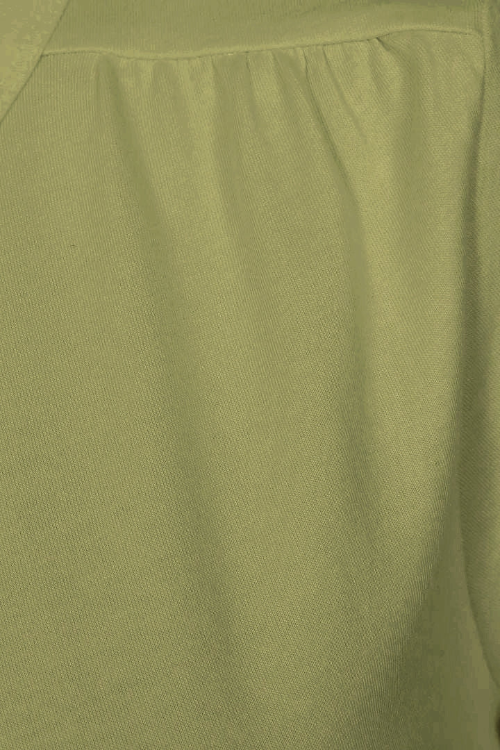 Close-up of a Mudd and Water womens olive green t-shirt with pleated shoulder detail.
