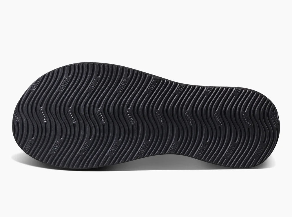 Underside view of Reef mens cushion flip flops featuring a textured sole for grip and comfort