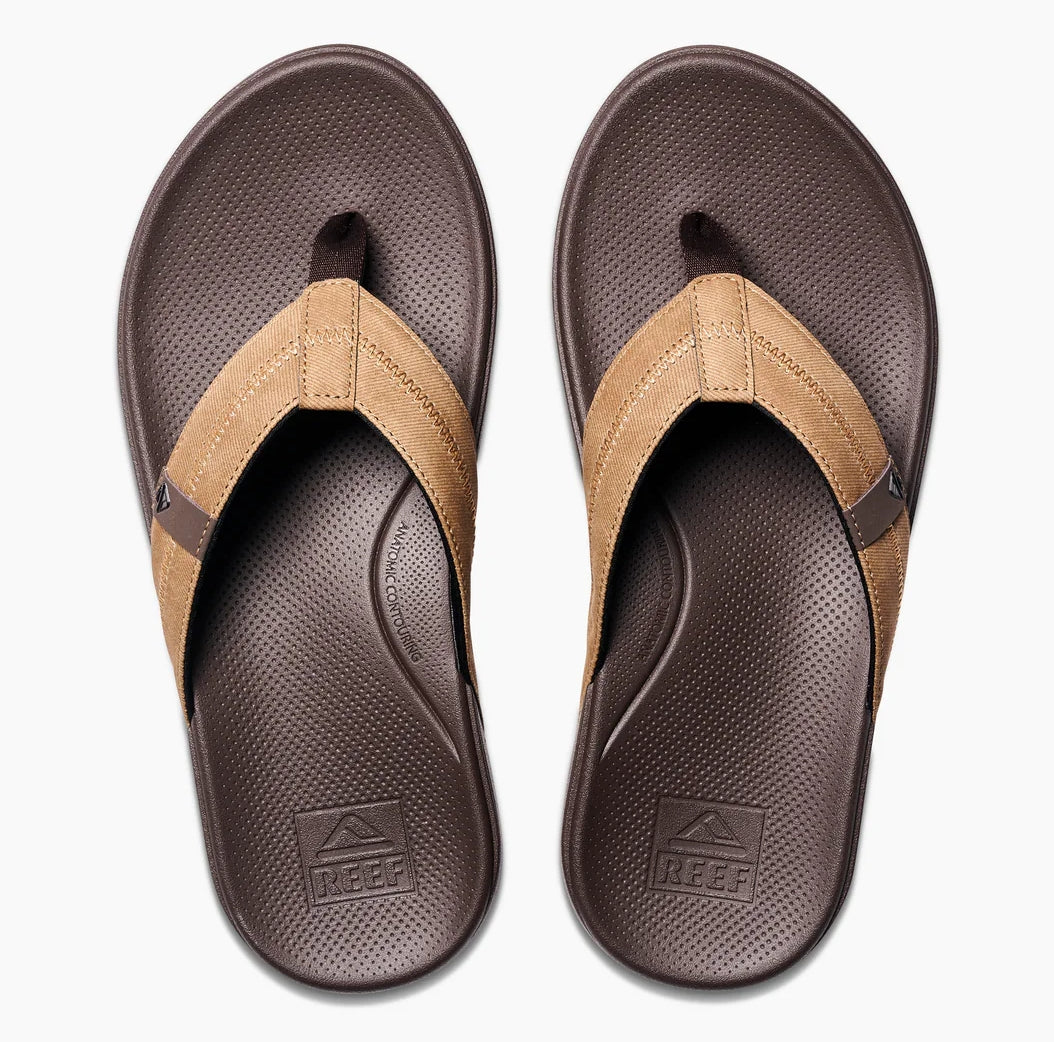 Reef mens cushion flip flops in brown with soft straps and comfortable footbed for everyday wear